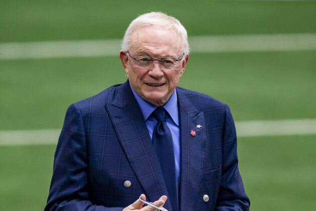 Dallas Cowboys owner Jerry Jones puts on a mask before an NFL football game against the Pittsburgh Steelers, Sunday, Nov. 8, 2020, in Arlington, Texas. Pittsburgh won 24-19. (AP Photo/Brandon Wade)