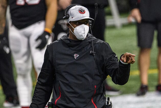 Atlanta Falcons interim head coach Raheem Morris works during the second half of an NFL football game against the New Orleans Saints, Sunday, Dec. 6, 2020, in Atlanta. The New Orleans Saints won 21-16. (AP Photo/Danny Karnik)
