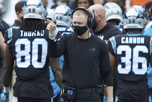 Carolina Panthers offensive coordinator Joe Brady watches from the sideline during an NFL football game against the Detroit Lions, Sunday, Nov. 22, 2020, in Charlotte, N.C. (AP Photo/Brian Westerholt)