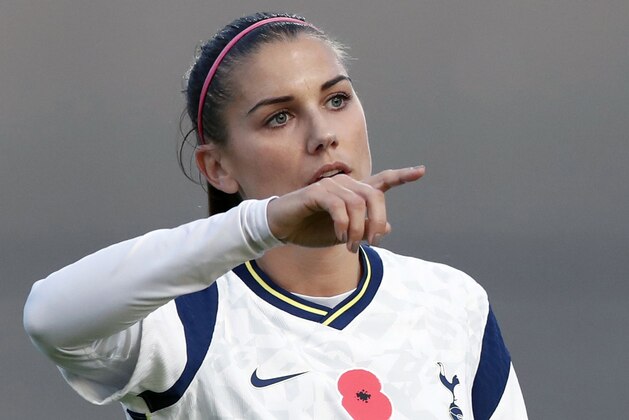 FILE - In this Saturday, Nov. 7, 2020 file photo, Tottenham Hotspur's Alex Morgan gestures to her teammates during the English Women's Super League soccer match between Tottenham Hotspur and Reading at the Hive stadium in London. American World Cup winner Alex Morgan won't be staying at Tottenham for the second half of the season after deciding to return home. (AP Photo/Alastair Grant, File)