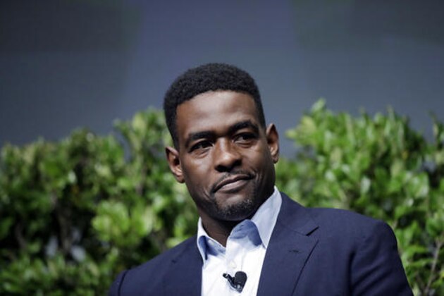 FILE - In this Jan. 24, 2017, file photo, former NBA player Chris Webber participates in a sports and activism panel in San Jose, Calif. Webber tells The Associated Press that he believes he and other former players “can change the game” with their unique perspective. (AP Photo/Marcio Jose Sanchez, File)