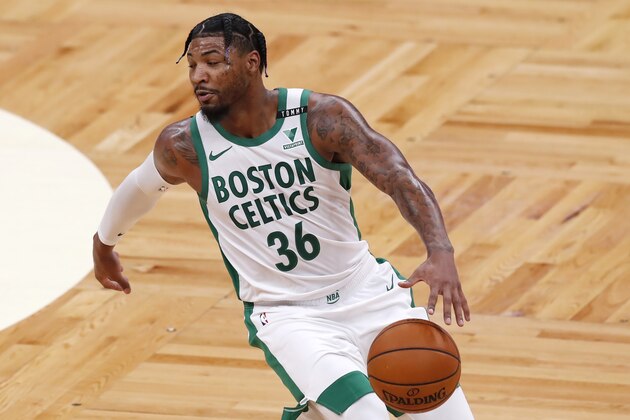 Boston Celtics' Marcus Smart plays against the Brooklyn Nets during the first half of an NBA basketball game, Friday, Dec. 25, 2020, in Boston. (AP Photo/Michael Dwyer)