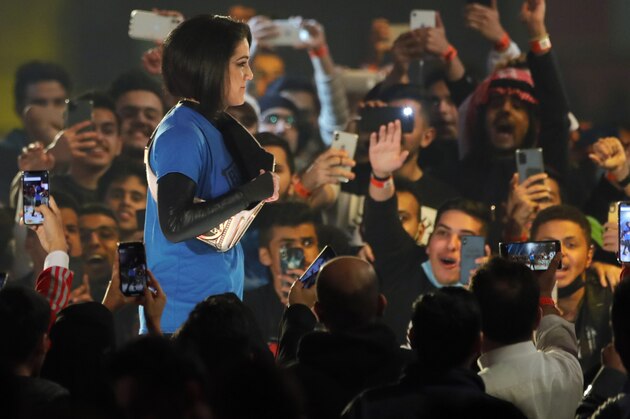 SmackDown Women's Champion Bayley is greeted by fans as she enters for the second-ever women's match in Saudi Arabia at WWE Super ShowDown in Riyadh, Saudi Arabia, late Thursday, Feb. 27, 2020. (AP Photo/Amr Nabil)