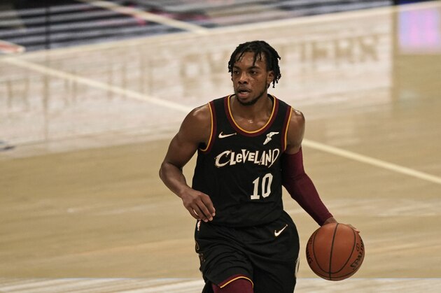 Cleveland Cavaliers' Darius Garland drives against the Philadelphia 76ers in the first half of an NBA basketball game, Sunday, Dec. 27, 2020, in Cleveland. (AP Photo/Tony Dejak)