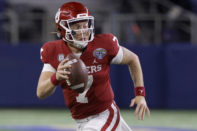 Oklahoma quarterback Spencer Rattler (7) scrambles against Florida during the NCAA Cotton Bowl college football game Wednesday, Dec.30, 2020, in Arlington, Texas. (AP Photo/Ron Jenkins)