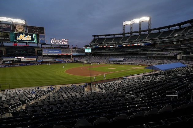 FILE - In this Sept. 9, 2020, file photo, Citi Field is viewed at dusk before a baseball game between the New York Mets and the Baltimore Orioles in New York. Billionaire hedge fund manager Steve Cohen has agreed to purchase the Mets from the Wilpon family. The team announced the agreement on Monday, Sept. 14, 2020. The deal is subject to the approval of Major League Baseball owners. (AP Photo/Kathy Willens, File)