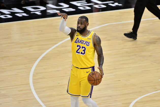 Los Angeles Lakers forward LeBron James (23) calls to teammates in the first half of an NBA basketball game against the Memphis Grizzlies Tuesday, Jan. 5, 2021, in Memphis, Tenn. (AP Photo/Brandon Dill)