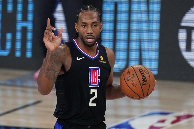 FILE - Los Angeles Clippers' Kawhi Leonard (2) gestures in the second half of an NBA conference semifinal playoff basketball game against the Denver Nuggets in Lake Buena Vista Fla., in this Thursday, Sept 3, 2020, file photo. Kawhi Leonard made a rare late-night television appearance, Wednesday, Dec. 16 with host Jimmy Kimmel kidding the Los Angeles Clippers superstar who avoids attention off the court about being a mysterious man. “Maybe to the outside world,” Leonard said. “The people around me know who I am.”(AP Photo/Mark J. Terrill, File)
