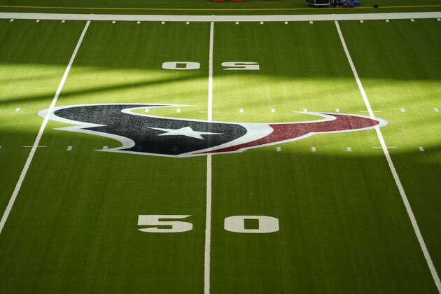 The Houston Texans logo can be seen a midfield at NRG Stadium before an NFL football game against the Indianapolis Colts, Sunday, Dec. 6, 2020, in Houston. (AP Photo/Matt Patterson)