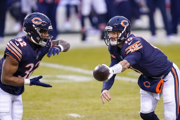 Chicago Bears' Mitchell Trubisky hands off to David Montgomery during the first half of an NFL football game against the Green Bay Packers Sunday, Jan. 3, 2021, in Chicago. (AP Photo/Charles Rex Arbogast)