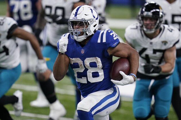 Indianapolis Colts' Jonathan Taylor (28) runs for a touchdown during the second half of an NFL football game against the Jacksonville Jaguars, Sunday, Jan. 3, 2021, in Indianapolis. (AP Photo/Michael Conroy)
