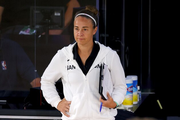 San Antonio Spurs assistant coach Becky Hammon of the San Antonio Spurs looks on against the Philadelphia 76ers during the second half of an NBA basketball game Monday, Aug. 3, 2020, in Lake Buena Vista, Fla. (Mike Ehrmann/Pool Photo via AP)