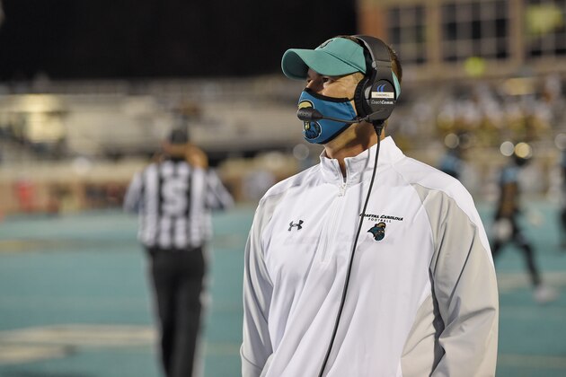 Coastal Carolina head coach Jamey Chadwell walks the sideline during the first half of an NCAA college football game against BYU Saturday, Dec. 5, 2020, in Conway, S.C. Coastal Carolina won 22-17. (AP Photo/Richard Shiro)