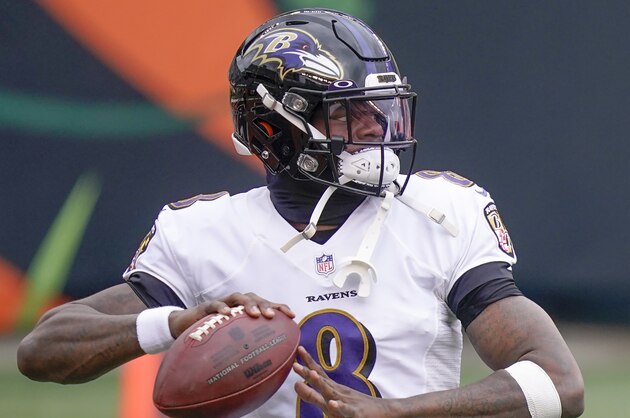 Baltimore Ravens quarterback Lamar Jackson (8) warms up before an NFL football game against the Cincinnati Bengals, Sunday, Jan. 3, 2021, in Cincinnati. (AP Photo/Bryan Woolston)