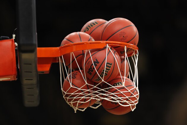 Basketballs fill a net before a second round women's college basketball game between Iowa and Missouri in the NCAA Tournament, Sunday, March 24, 2019, in Iowa City, Iowa. (AP Photo/Charlie Neibergall)