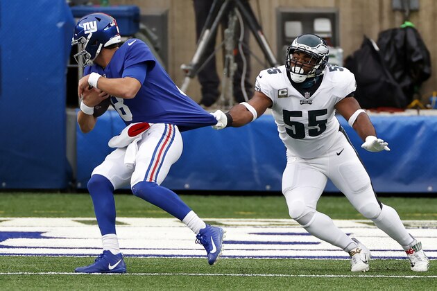 New York Giants quarterback Daniel Jones (8) scrambles away from Philadelphia Eagles defensive end Brandon Graham (55) in action during an NFL football game, Sunday, Nov. 15, 2020, in East Rutherford, N.J. (AP Photo/Adam Hunger)