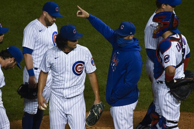 Chicago Cubs manager David Ross, right, points to the bullpen, after relieving Yu Darvish, left, during the seventh inning of a baseball game against the Minnesota Twins Sunday, Sept. 20, 2020, in Chicago. (AP Photo/Matt Marton)