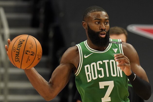 Boston Celtics guard Jaylen Brown (7) looks to pass against the Toronto Raptors during the second half of an NBA basketball game Monday, Jan. 4, 2021, in Tampa, Fla. (AP Photo/Chris O'Meara)