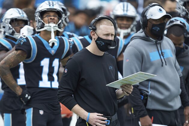 Carolina Panthers offensive coordinator Joe Brady watches from the sideline during an NFL football game against the Detroit Lions, Sunday, Nov. 22, 2020, in Charlotte, N.C. (AP Photo/Brian Westerholt)