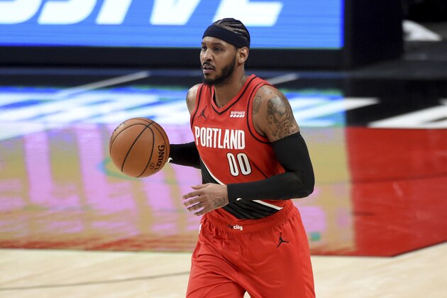 Portland Trail Blazers forward Carmelo Anthony brings the ball up the court during the second half of an NBA basketball game against the Houston Rockets in Portland, Ore., Saturday, Dec. 26, 2020. The Blazers won 128-126 in overtime. (AP Photo/Steve Dykes)