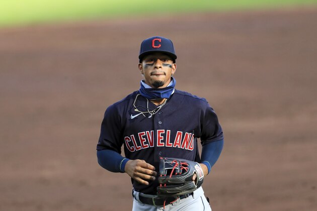Cleveland Indians' Francisco Lindor (12) plays the field during a baseball game against the Cincinnati Reds in Cincinnati, Tuesday, Aug. 4, 2020. The Indians won 4-2. (AP Photo/Aaron Doster)