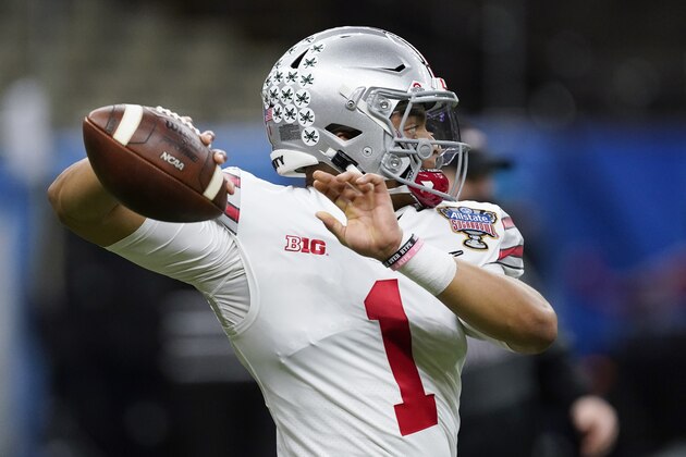 Ohio State quarterback Justin Fields warms up before the Sugar Bowl NCAA college football game against Clemson Friday, Jan. 1, 2021, in New Orleans. (AP Photo/John Bazemore)