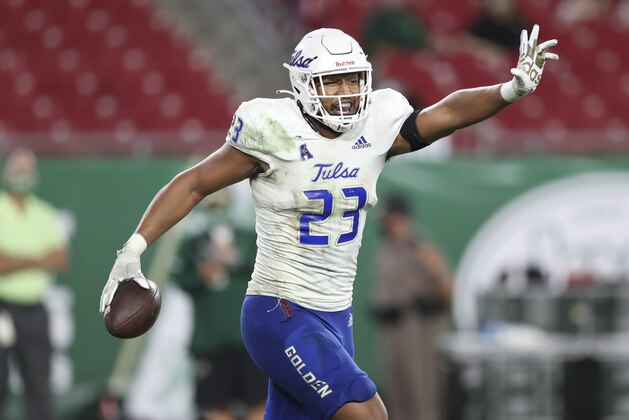 FILE - Tulsa linebacker Zaven Collins (23) celebrates after scoring a touchdown during an NCAA football game in Tampa, Fla., in this Oct. 23, 2020, file photo. Collins was selected to The Associated Press All-America first-team defense, Monday, Dec. 28, 2020. (AP Photo/Mark LoMoglio, File)