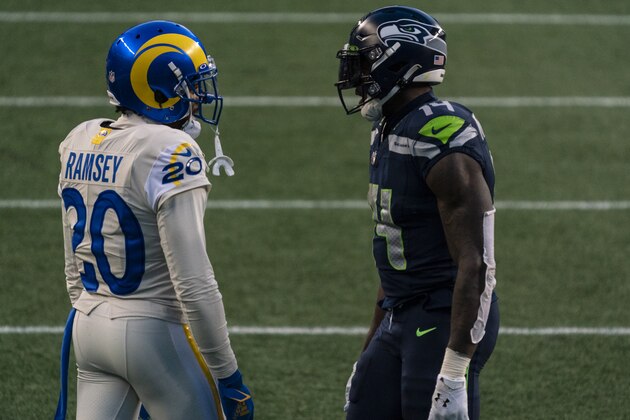 Los Angeles Rams defensive back Jalen Ramsey (20) and Seattle Seahawks wide receiver DK Metcalf talk between plays during the second half of an NFL football game, Sunday, Dec. 27, 2020, in Seattle. The Seahawks won 20-9. (AP Photo/Stephen Brashear)