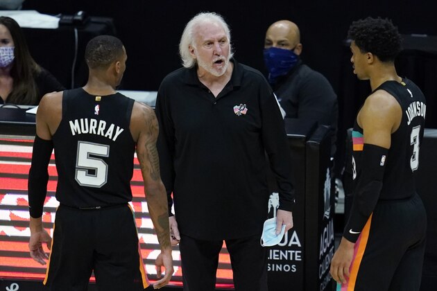 San Antonio Spurs coach Gregg Popovich, center, yells from the sideline during the fourth quarter of the team's NBA basketball game against the Los Angeles Clippers on Tuesday, Jan. 5, 2021, in Los Angeles. (AP Photo/Ashley Landis)