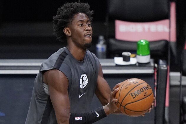 Brooklyn Nets guard Caris LeVert shoots while warming up before an NBA basketball game against the Memphis Grizzlies, Monday, Dec. 28, 2020, in New York. (AP Photo/Kathy Willens)