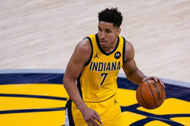 Indiana Pacers guard Malcolm Brogdon (7) plays against the New York Knicks during the first half of an NBA basketball game in Indianapolis, Wednesday, Dec. 23, 2020. (AP Photo/Michael Conroy)