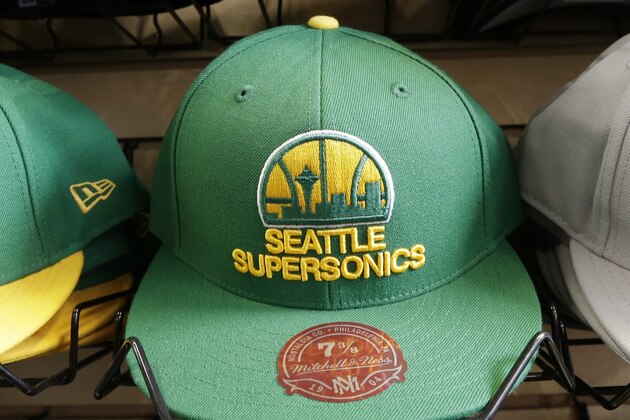 Stacks of Seattle SuperSonics caps sit in a shop near where a proposed NBA arena is set to be built Wednesday, May 15, 2013 in Seattle. NBA owners voted Wednesday to reject the Sacramento Kings' proposed move to Seattle, the latest in a long line of cities that have tried to land the franchise.  (AP Photo/Elaine Thompson)