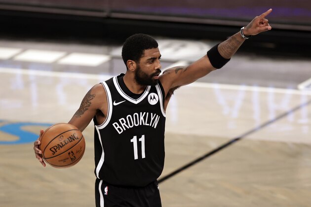 Brooklyn Nets guard Kyrie Irving (11) gestures during an NBA basketball game against the Atlanta Hawks, Friday, Jan. 1, 2021, in New York. The Hawks won 114-96. (AP Photo/Adam Hunger)