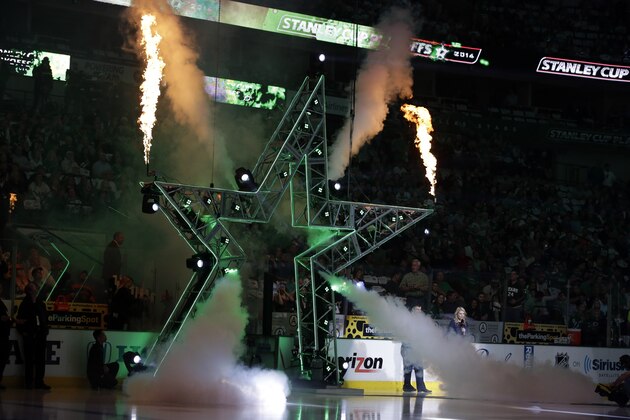 Thd Dallas Stars logo is illuminated before  Game 4 of a first-round NHL hockey Stanley Cup playoff series game against the Anaheim Ducks, Wednesday, April 23, 2014, in Dallas. (AP Photo/Tony Gutierrez)