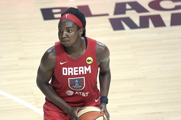 Atlanta Dream center Elizabeth Williams sets up for a shot during the second half of a WNBA basketball game against the Dallas Wings, Sunday, July 26, 2020, in Bradenton, Fla. (AP Photo/Phelan M. Ebenhack)