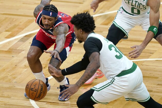 Boston Celtics guard Marcus Smart (36) steals the ball from Washington Wizards guard Bradley Beal (3) during the first quarter of an NBA basketball game Friday, Jan. 8, 2021, in Boston. (AP Photo/Elise Amendola)