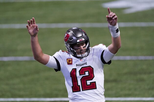Tampa Bay Buccaneers quarterback Tom Brady (12) reacts after a Tampa Bay Buccaneers touchdown against the Atlanta Falcons during the second half of an NFL football game, Sunday, Dec. 20, 2020, in Atlanta. (AP Photo/John Bazemore)