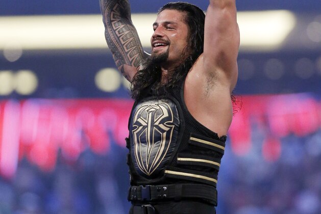 IMAGE DISTRIBUTED FOR WWE - WWE superstar new world heavy weight champion Roman Reigns celebrates his victory at WrestleMania 32 at AT&T Stadium on Sunday, April 3, 2016, in Arlington, Texas. (Brandon Wade/AP Images for WWE)