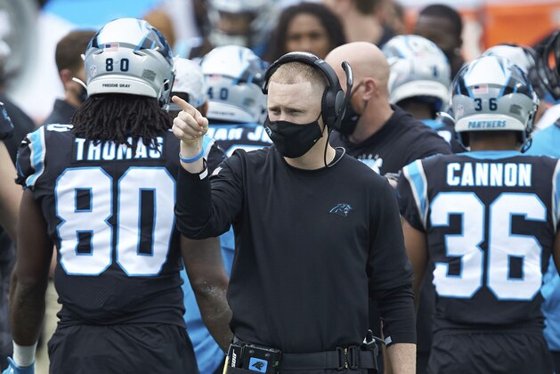 Carolina Panthers offensive coordinator Joe Brady watches from the sideline during an NFL football game against the Detroit Lions, Sunday, Nov. 22, 2020, in Charlotte, N.C. (AP Photo/Brian Westerholt)