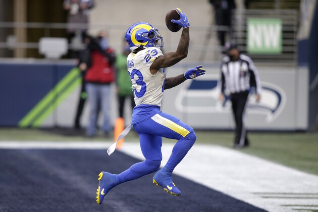Los Angeles Rams running back Cam Akers reacts after scoring on a 5-yard run against the Seattle Seahawks during the first half of an NFL wild-card playoff football game, Saturday, Jan. 9, 2021, in Seattle. (AP Photo/Scott Eklund)