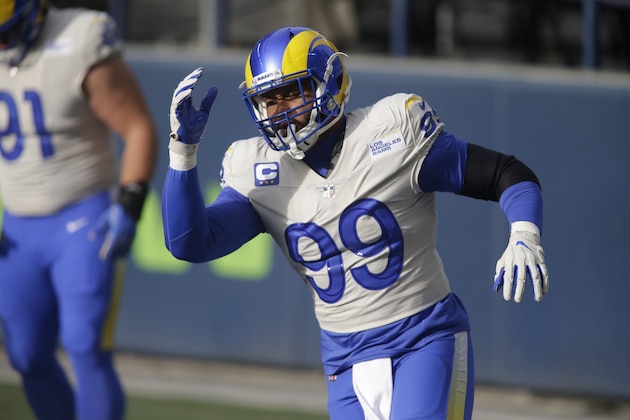 Los Angeles Rams defensive end Aaron Donald warms-up before an NFL wild-card playoff football game against the Seattle Seahawks, Saturday, Jan. 9, 2021, in Seattle. (AP Photo/Scott Eklund)