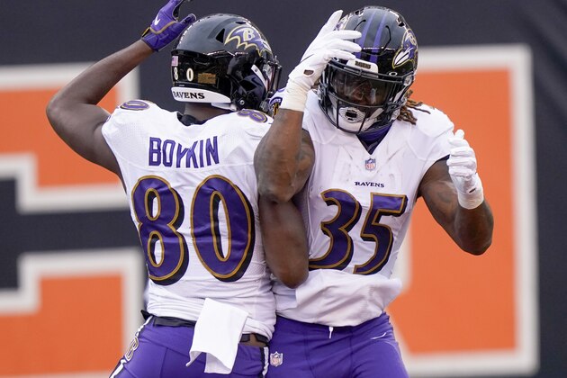 Baltimore Ravens wide receiver Miles Boykin (80) celebrates with running back Gus Edwards (35) after making a catch and taking it in for a touchdown against the Cincinnati Bengals during the first half of an NFL football game, Sunday, Jan. 3, 2021, in Cincinnati. (AP Photo/Bryan Woolston)