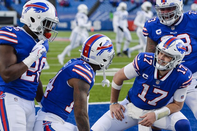 Buffalo Bills' Josh Allen (17) celebrates with teammate Stefon Diggs (14), Dion Dawkins (73), and Zack Moss (20) after connecting with Diggs for a touchdown during the second half of an NFL wild-card playoff football game against the Indianapolis Colts Saturday, Jan. 9, 2021, in Orchard Park, N.Y. (AP Photo/Adrian Kraus)