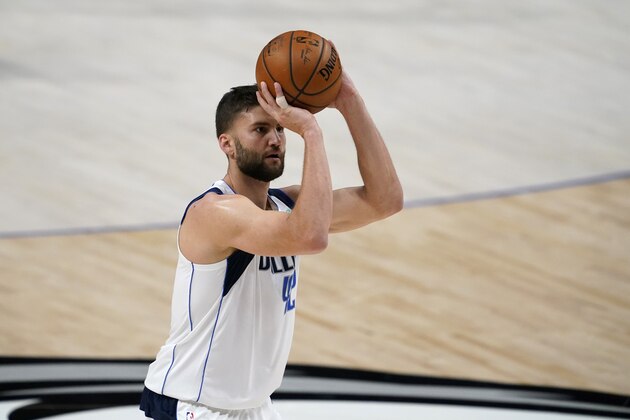 Dallas Mavericks' Maxi Kleber (42) shoots free throws during an NBA preseason basketball game against the Minnesota Timberwolves in Dallas, Thursday, Dec. 17, 2020. (AP Photo/Tony Gutierrez)