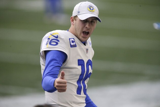 Los Angeles Rams quarterback Jared Goff motions from the sidelines against the Seattle Seahawks during the second half of an NFL wild-card playoff football game, Saturday, Jan. 9, 2021, in Seattle. (AP Photo/Scott Eklund)