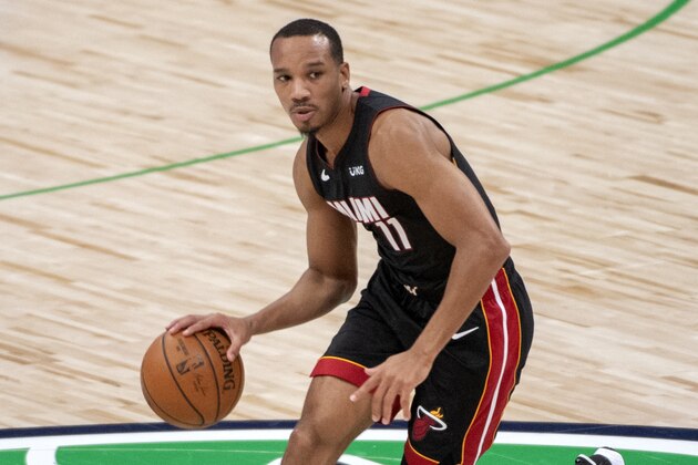 Miami Heat guard Avery Bradley (11) dribbles during an NBA basketball game against the Dallas Mavericks, Friday, Jan. 1, 2021, in Dallas. Dallas won 93-83. (AP Photo/Jeffrey McWhorter)
