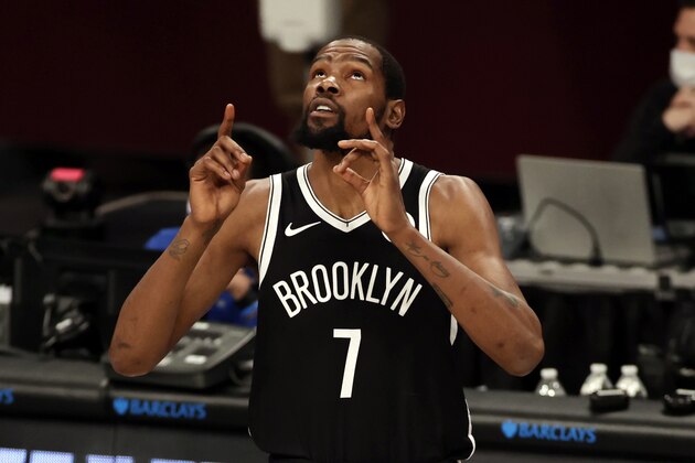 Brooklyn Nets forward Kevin Durant reacts walking on to the court before the first half of an NBA basketball game against the Atlanta Hawks, Friday, Jan. 1, 2021, in New York. (AP Photo/Adam Hunger)