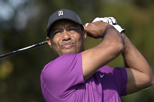 Tiger Woods watches his tee shot on the first hole during the first round of the PNC Championship golf tournament, Saturday, Dec. 19, 2020, in Orlando, Fla. (AP Photo/Phelan M. Ebenhack)