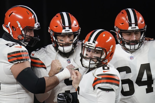 Cleveland Browns quarterback Baker Mayfield (6) takes the field for warm ups with center, Anthony Fabiano, left, quarterback Case Keenum (5), and center JC Tretter (64) before an NFL wild-card playoff football game, Sunday, Jan. 10, 2021, in Pittsburgh. (AP Photo/Keith Srakocic)