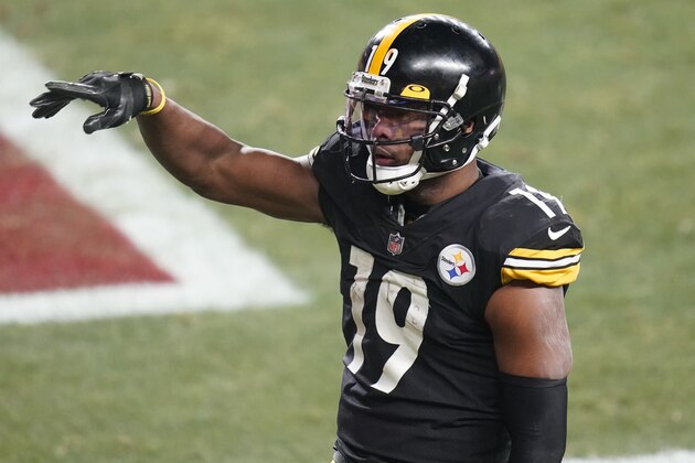 Pittsburgh Steelers wide receiver JuJu Smith-Schuster (19) celebrates after scoring on a 5-yard pass from quarterback Ben Roethlisberger during the second half of an NFL wild-card playoff football game against the Cleveland Browns, Sunday, Jan. 10, 2021, in Pittsburgh. (AP Photo/Keith Srakocic)